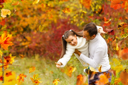 happy family father and child girl daughter playing and laughing in autumn park 