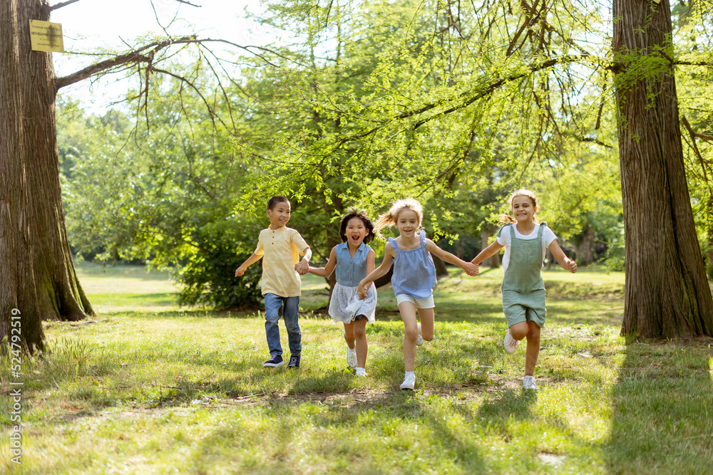 Group of asian and caucasian kids having fun in the park Group of asian and caucasian kids having fun in the park