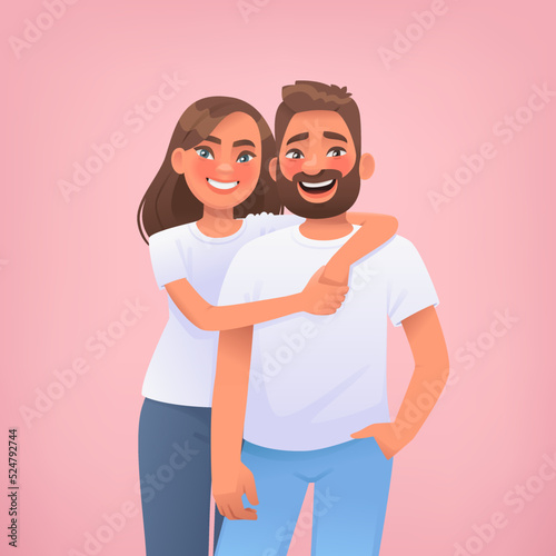 Couple of young people on a pink background. Portrait of happy man and woman embracing. The concept of love and relationships. Valentine  Day