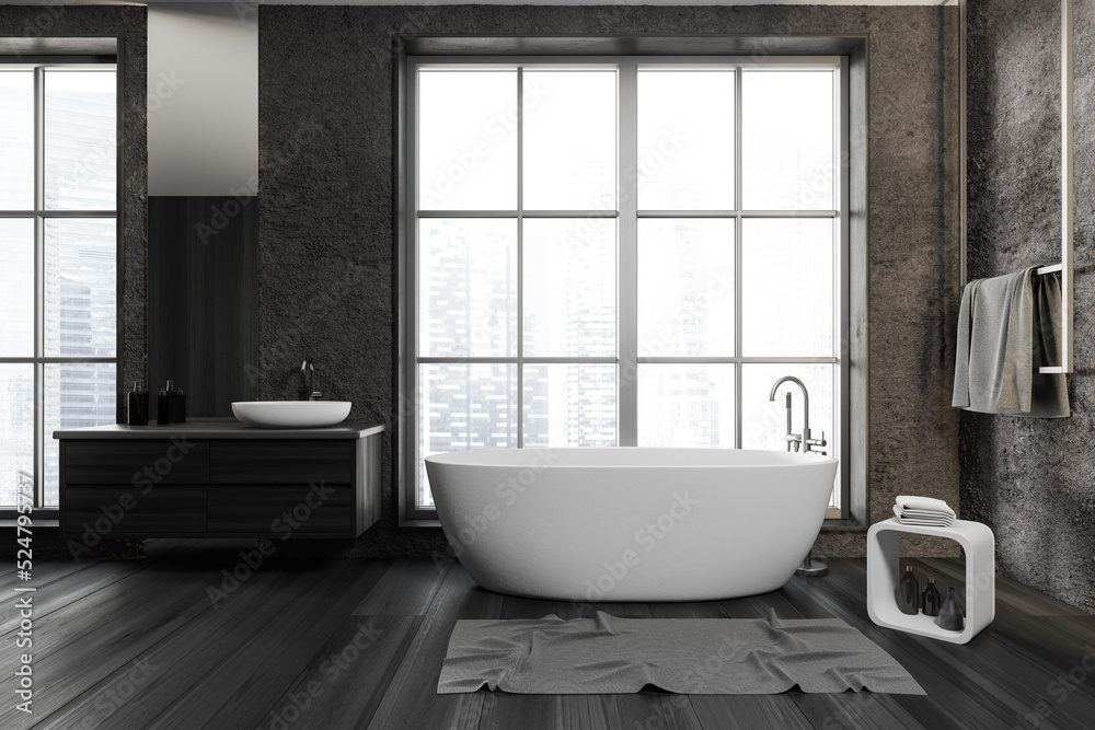 Front view on dark bathroom interior with bathtub, panoramic window Front view on dark bathroom interior with bathtub, panoramic window