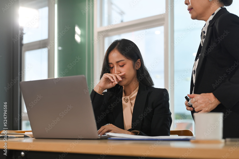 Senior Female executive manager blaming employee for mistake or failure. Senior Female executive manager blaming employee for mistake or failure.
