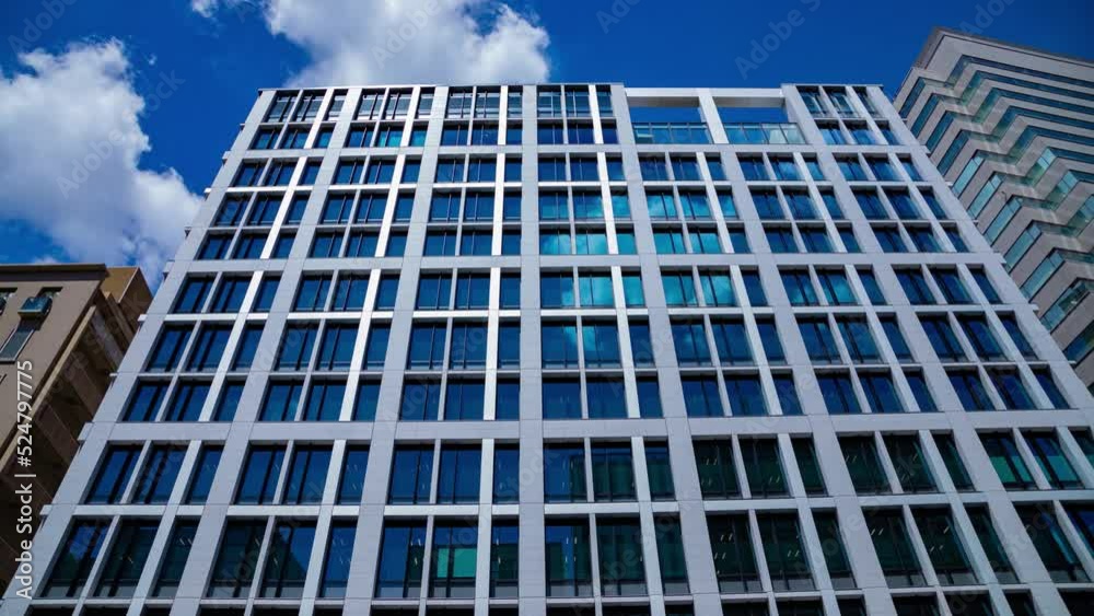 A timelapse of cloud reflecting the building in the business town A timelapse of cloud reflecting the building in the business town