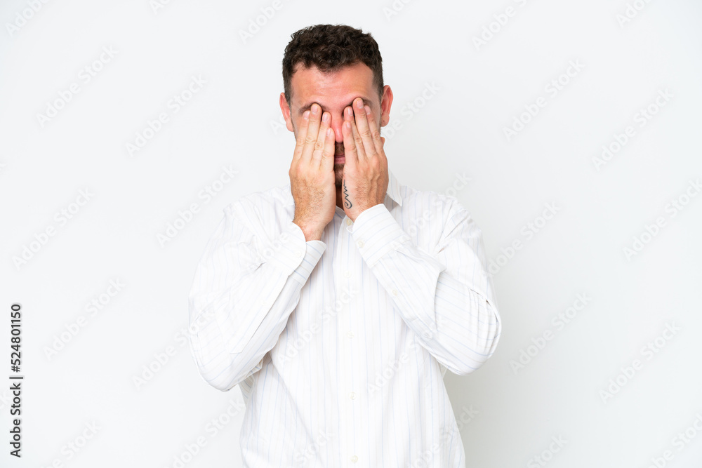 Young caucasian handsome man isolated on white background covering eyes by hands Young caucasian handsome man isolated on white background covering eyes by hands