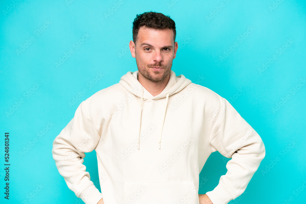 Young caucasian handsome man isolated on blue background angry Young caucasian handsome man isolated on blue background angry