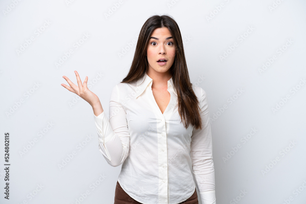 Young Brazilian woman isolated on white background making doubts gesture Young Brazilian woman isolated on white background making doubts gesture