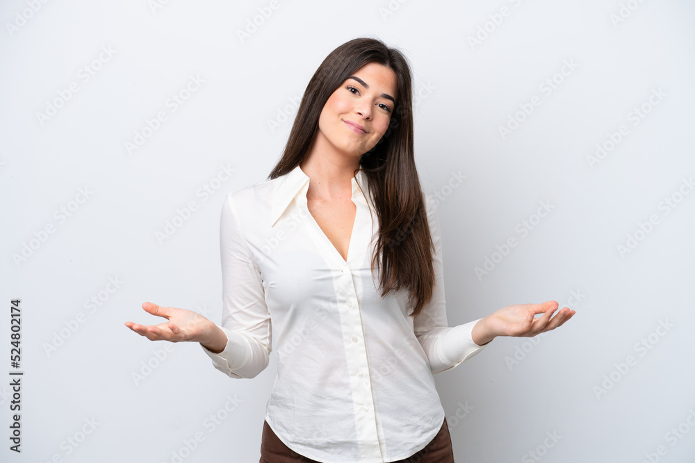 Young Brazilian woman isolated on white background having doubts Young Brazilian woman isolated on white background having doubts