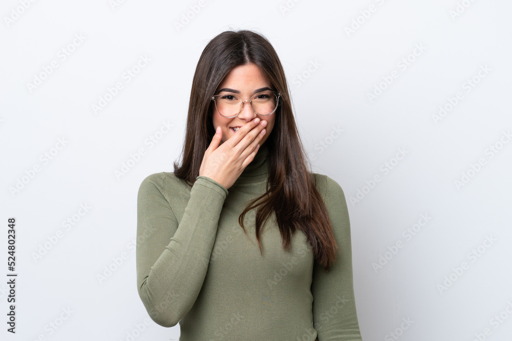 Young Brazilian woman isolated on white background happy and smiling covering mouth with hand Young Brazilian woman isolated on white background happy and smiling covering mouth with hand