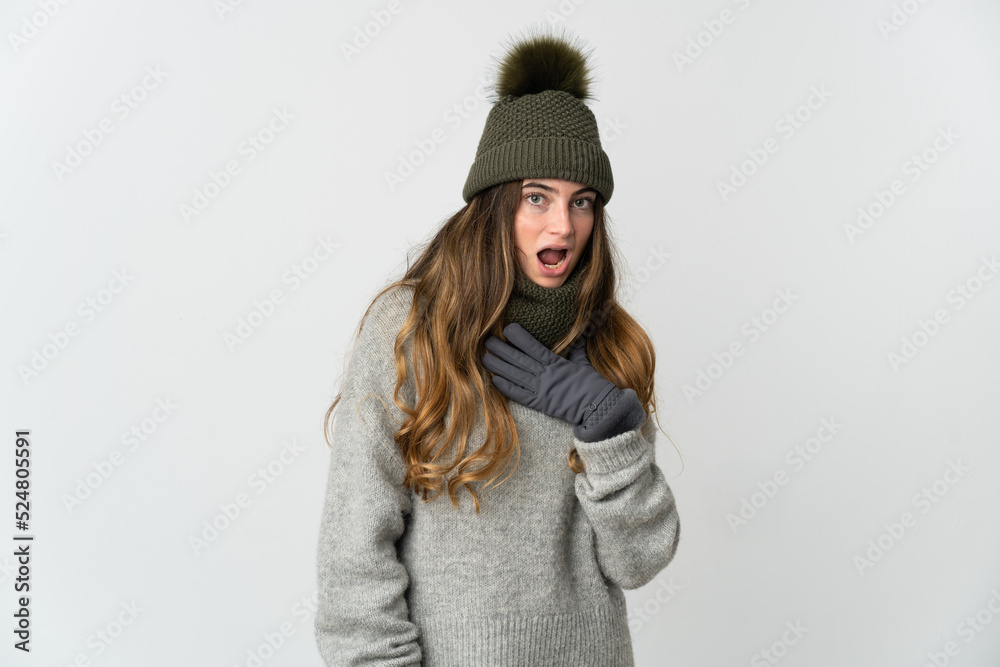 Young caucasian woman with winter hat isolated on white background surprised and shocked while looking right Young caucasian woman with winter hat isolated on white background surprised and shocked while looking right