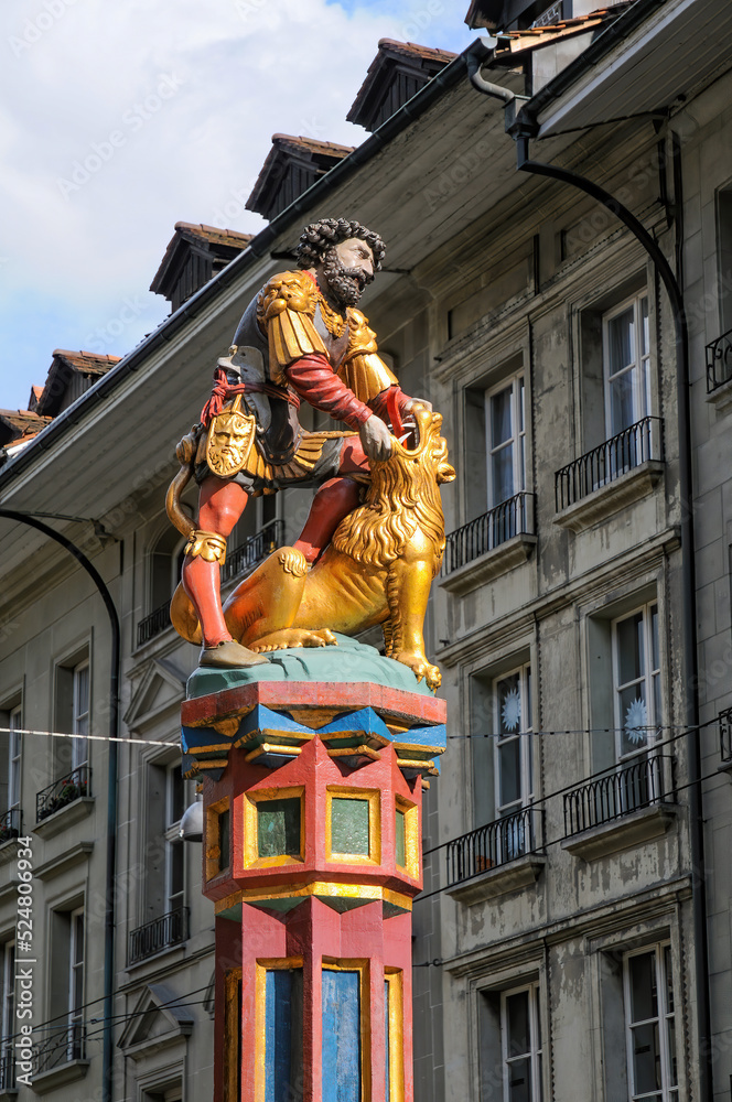 Simsonbrunnen Fountain in the center of Bern, Switzerland. The colorful statue of the biblical character Samson killing a lion