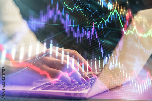Wallpaper Mural Double exposure of businesswoman hands typing on computer and forex chart hologram drawing. Financial analysis concept. Torontodigital.ca