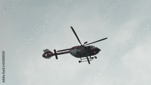Hochwald, Oybin, Germany . August 20, 2022. The rescue helicopter hovers over the landscape and monitors the situation. The helicopter is waiting for a signal to intervene.