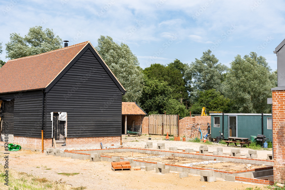 An old barn and stables that are in the middle of getting converted into a modern family home An old barn and stables that are in the middle of getting converted into a modern family home