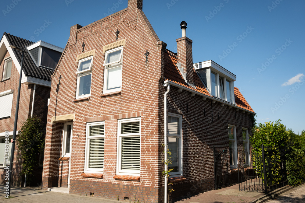 typical Dutch house on a street located in Oud-Beijerland Netherlands typical Dutch house on a street located in Oud-Beijerland Netherlands