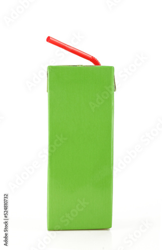 Green carton box with red plastic straw. Rectangular paper juice pack 