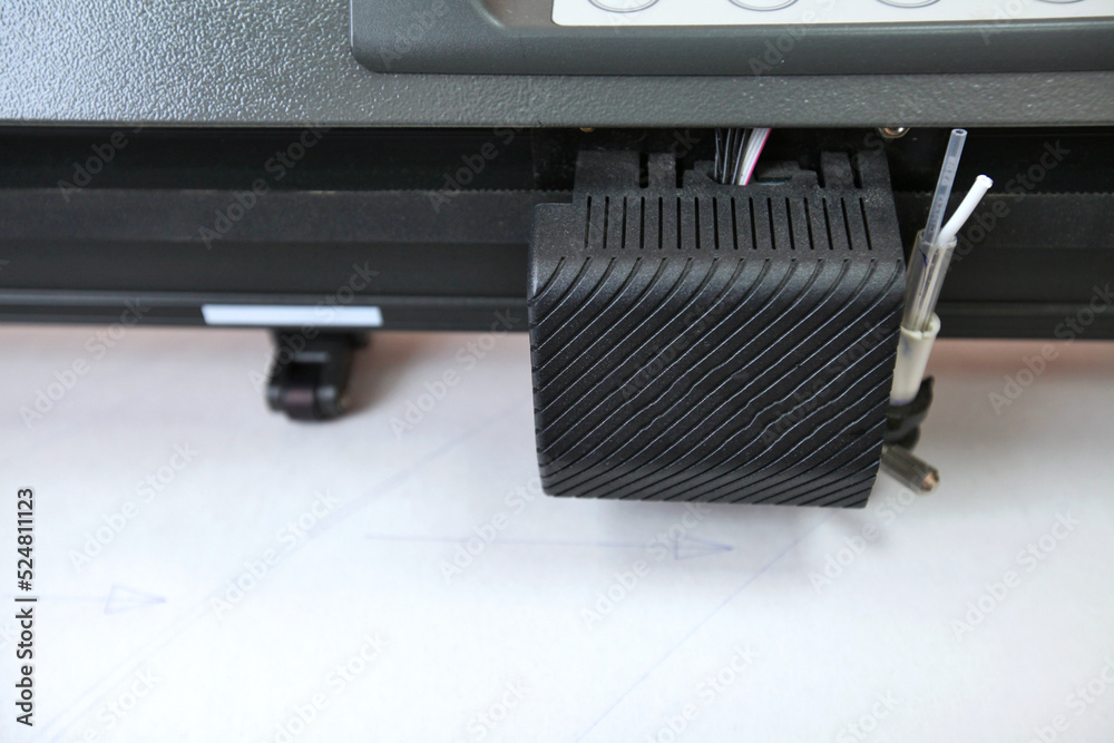 Computerized robot for automatic writing with a pen. Sewing shop. Material marking is automated. Computerized robot for automatic writing with a pen. Sewing shop. Material marking is automated.