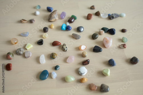 colored stones and minerals lie on the table in daylight. Exhibition of stones  sale  trade  selection. Fair  Good Buy
