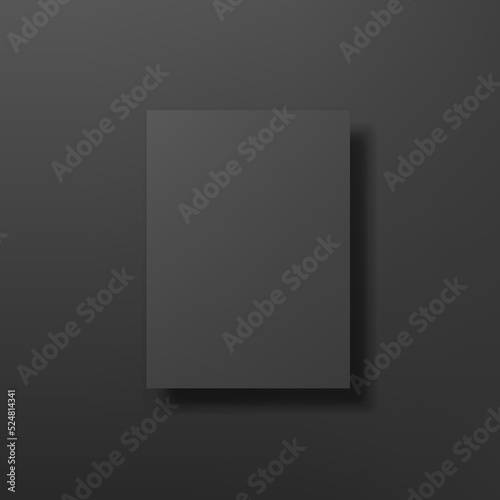 Black poster mockup hanging on black wall.