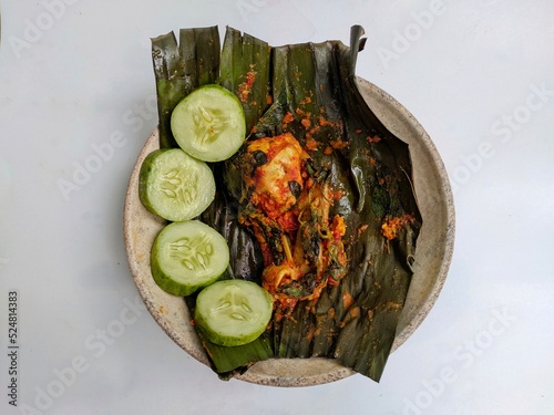 Pepes food on aplate,pepes is traditional food from indonesia photo