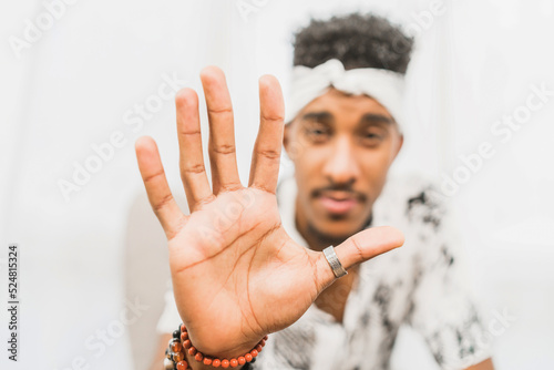 Man showing stop gesture at camera photo