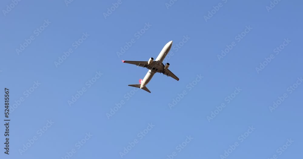 A passenger plane takes off in the sky, close-up A passenger plane takes off in the sky, close-up