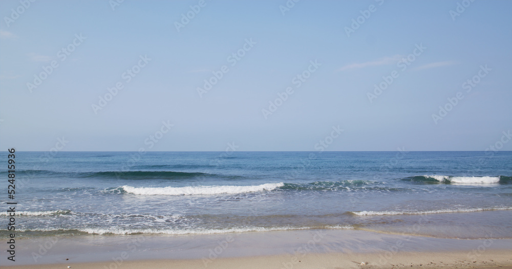 Sea wave over the sand beach