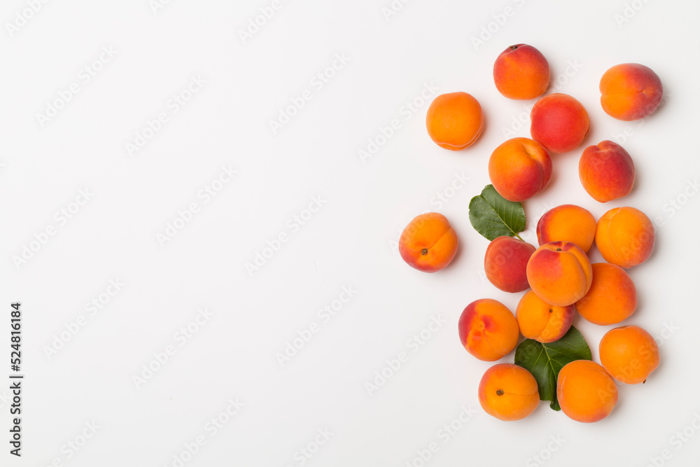 Flat lay with ripe apricots on white background, top view Flat lay with ripe apricots on white background, top view