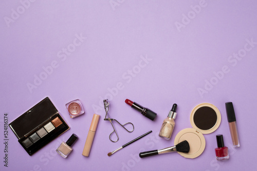 Fototapeta Naklejka Na Ścianę i Meble -  Different makeup products on color background, top view