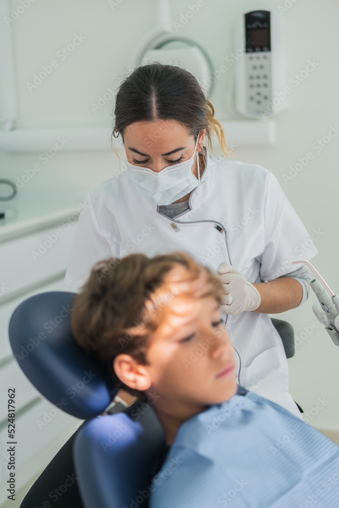 Dentists preparing for curing boy Dentists preparing for curing boy