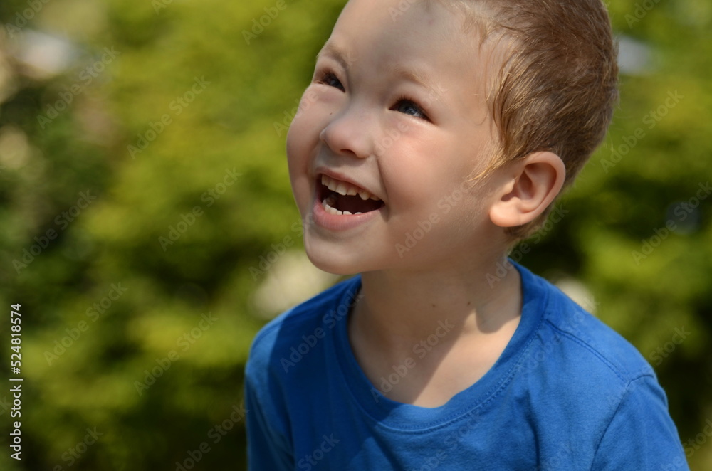 Portrait of a little boy. Emotions of the child, smile, sadness, thoughtful look. Blond boy with blue eyes, close-up, space for text Portrait of a little boy. Emotions of the child, smile, sadness, thoughtful look. Blond boy with blue eyes, close-up, space for text