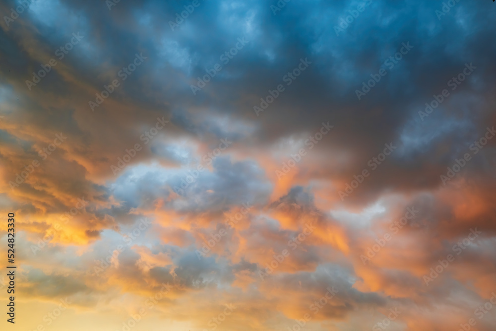 Majestic clouds burning by sunset. Sky background