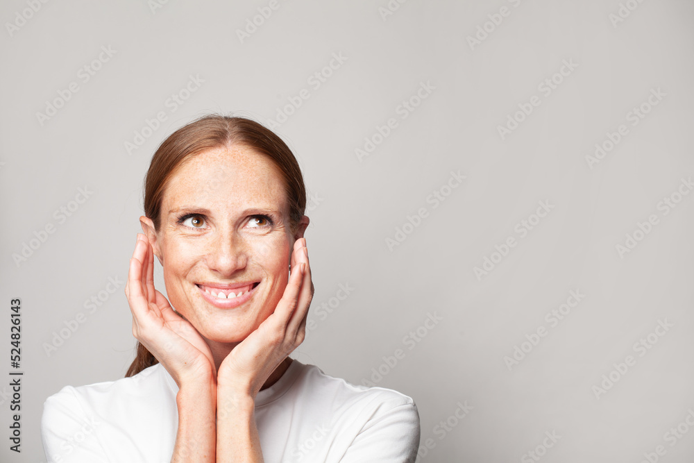 Pretty female face closeup. Smiling woman on white background. Pretty female face closeup. Smiling woman on white background.