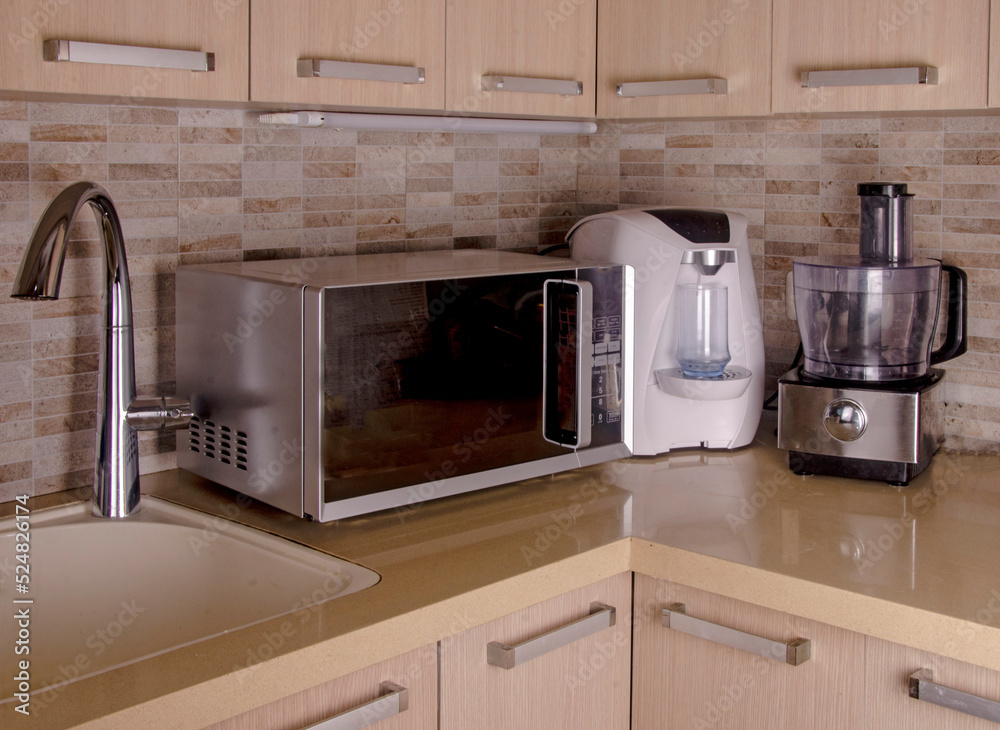 Blender, microwave, and mimibar in kitchen Blender, microwave, and mimibar in kitchen