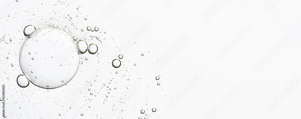 The texture of a cosmetic serum with bubbles in closeup. Copy space - obrazy, fototapety, plakaty 
