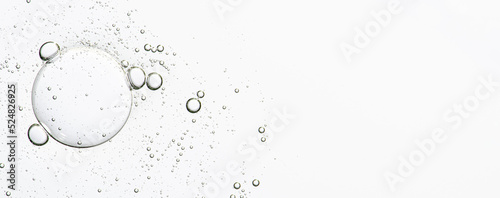 The texture of a cosmetic serum with bubbles in closeup. Copy space photo