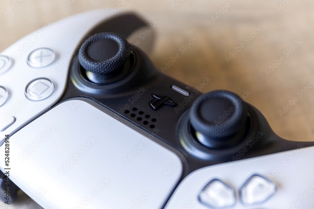 BRECHT, BELGIUM – AUGUST 14 2022: Close up portrait of the sticks of a  white basic playstation