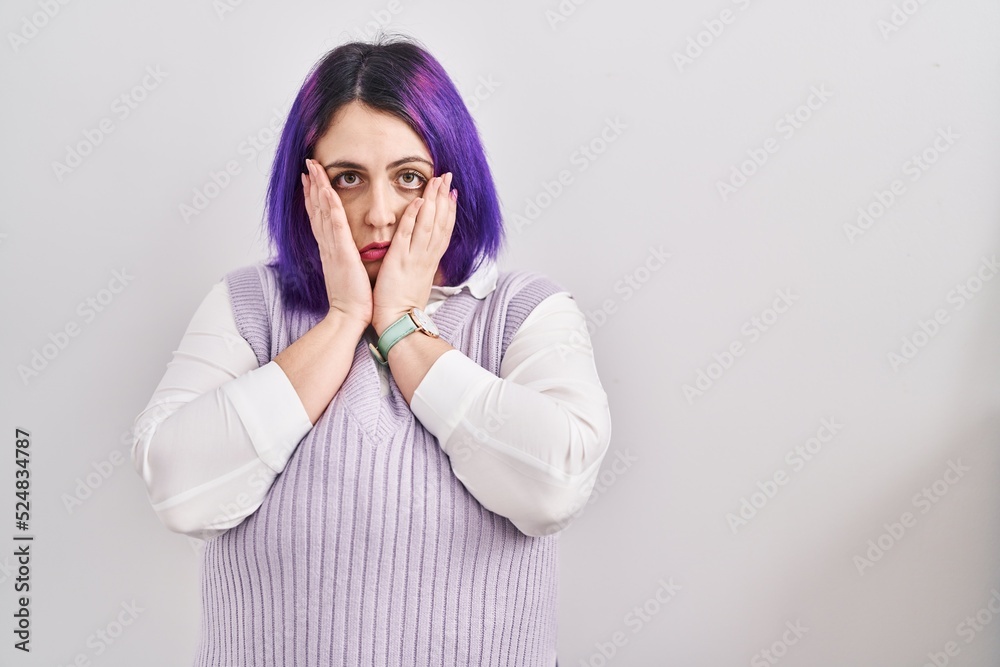 Plus size woman wit purple hair standing over white background tired hands covering face, depression and sadness, upset and irritated for problem