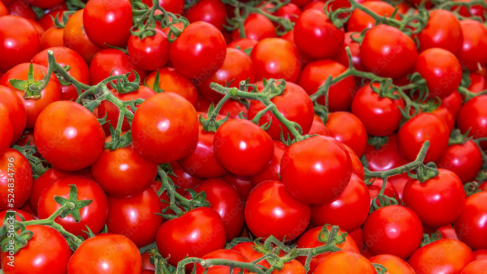 Fresh tomatoes on the street market. Background. Texture of natural tomato. Close-up