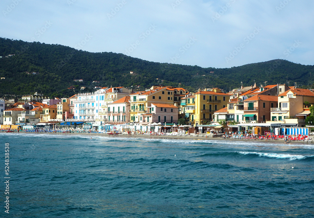 Beautiful view on a sunny day of the sea and the town of Alassio with colorful buildings, Liguria, Italian Riviera, region San Remo, Cote d'Azur, Italy
