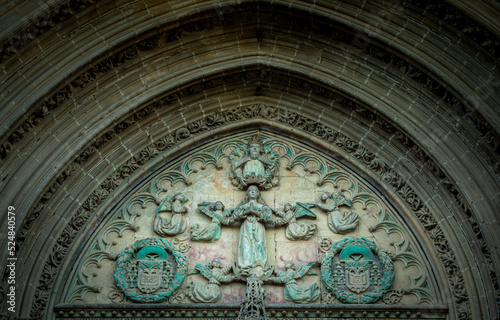 Detail of the side facade of the Church of San Pablo in Úbeda, Jaén, Spain with sculptures of saints and pointed arches