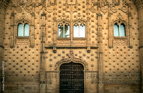 Renaissance facade of the ornately decorated Palacio de Jabalquinto in Baeza, Jaen, Andalusia, Spain photo
