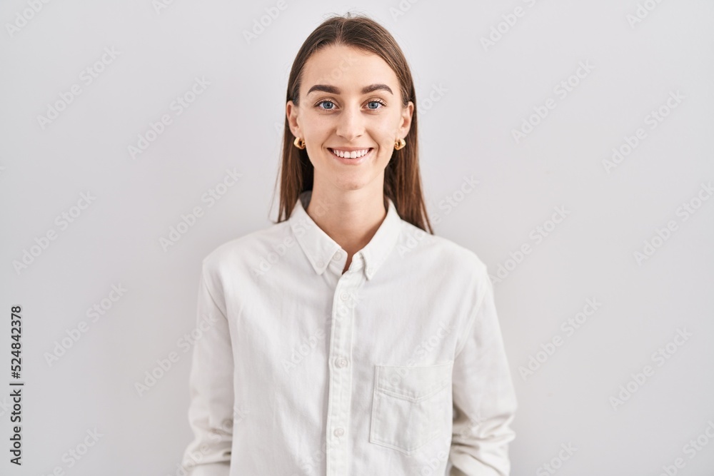 Young caucasian woman standing over isolated background with a happy and cool smile on face. lucky person. Young caucasian woman standing over isolated background with a happy and cool smile on face. lucky person.