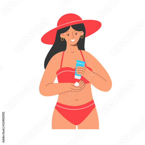 Pretty woman applies sunscreen to the skin