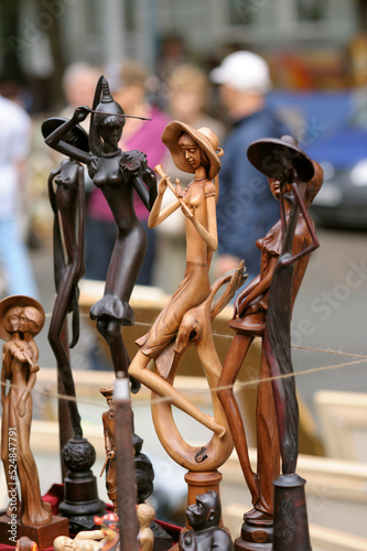 Handmade wooden figurines put up for sale, street fair. Andreevsky descent. Kyiv, Ukraine