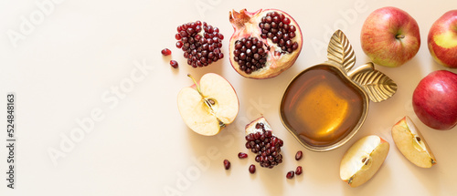Rosh hashanah concept - honey, pomegranate and apples photo