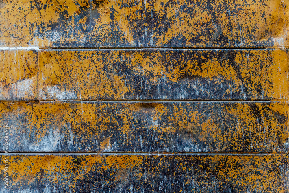 Grunge rusty metal texture background with patches of old yellow paint Grunge rusty metal texture background with patches of old yellow paint