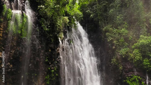 Aerial view of waterfall in the rainforest. Mimbalut Falls Waterfall in the tropical mountain jungle. Philippines, Mindanao. Iligan City, Lanao del Norte. photo