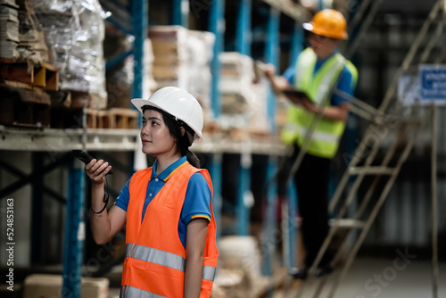 Warehouse workers selling stock checks with tablets and bar code launcher,business idea