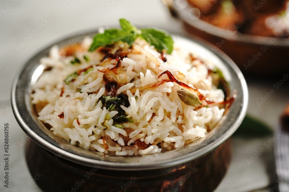 Malabar Ghee Rice or Nei choru with chicken curry, selective focus
