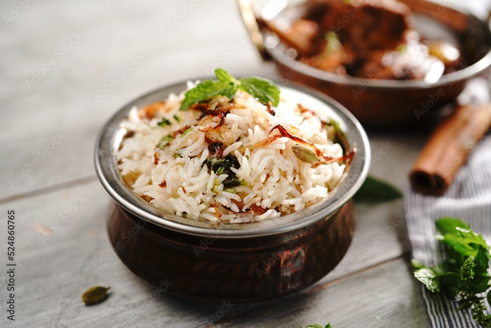 Malabar Ghee Rice or Nei choru with chicken curry, selective focus Malabar Ghee Rice or Nei choru with chicken curry, selective focus