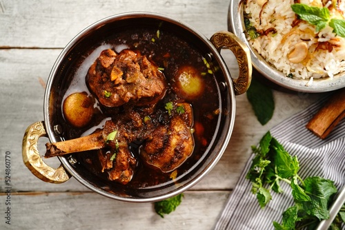 Malabar Chicken curry served with ghee rice or Nei choru, selective focus photo